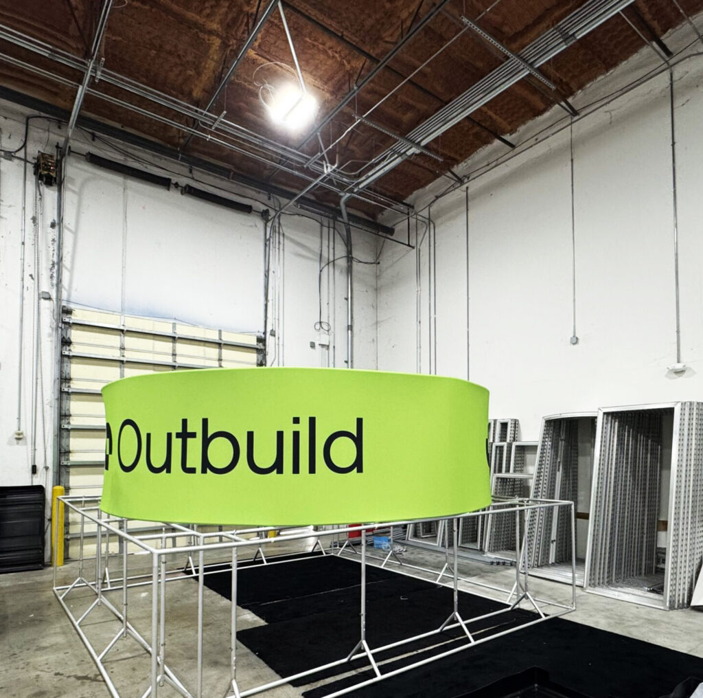 bright-custom-hanging-sign-for-construction-tradeshow-orlando "Bright custom hanging sign for construction trade show booth in Orlando with bold graphics and branding
