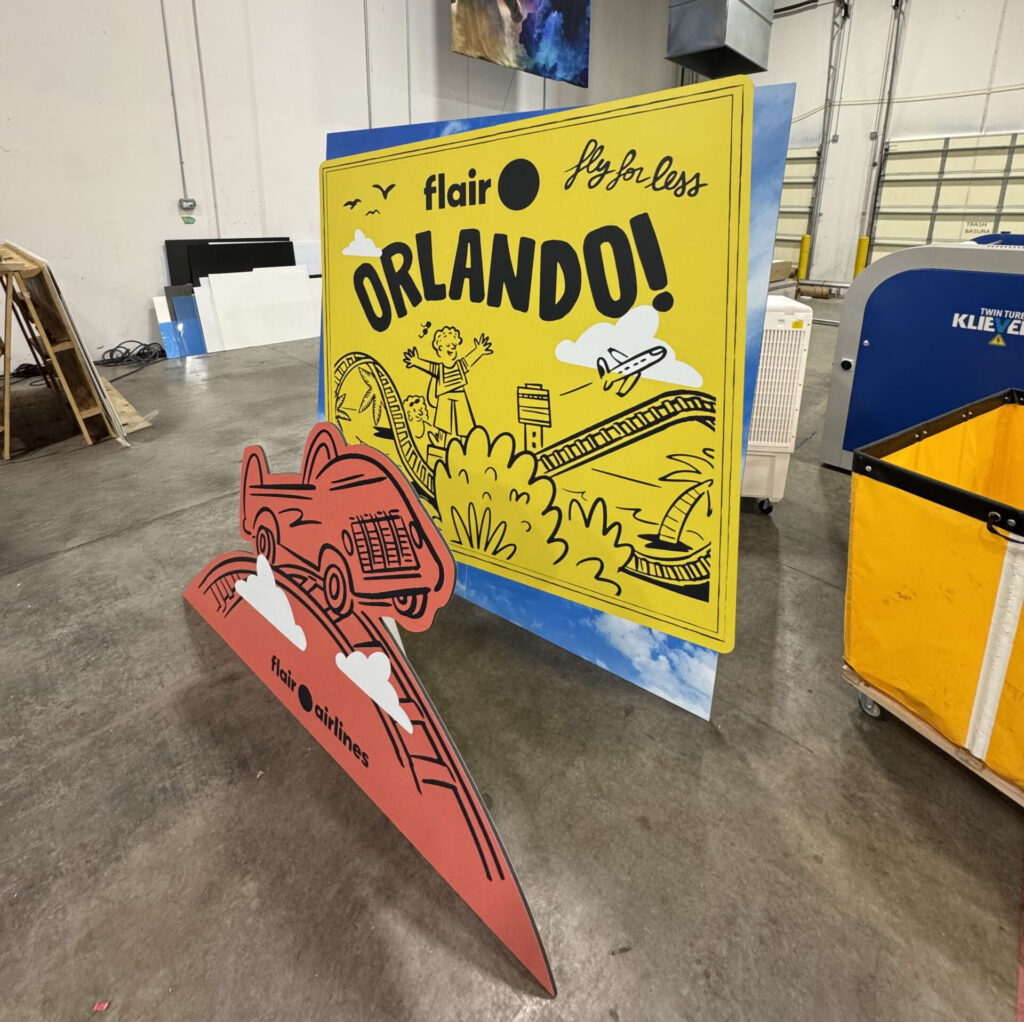 contour-cut-foam-core-graphics-for-airline Contour-cut foam core graphics for airline branding display with custom shapes and logo elements
